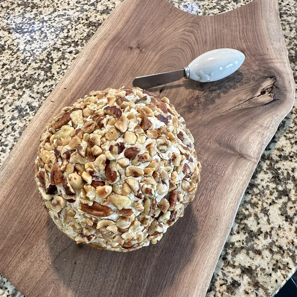 A cheese ball rolled in nuts