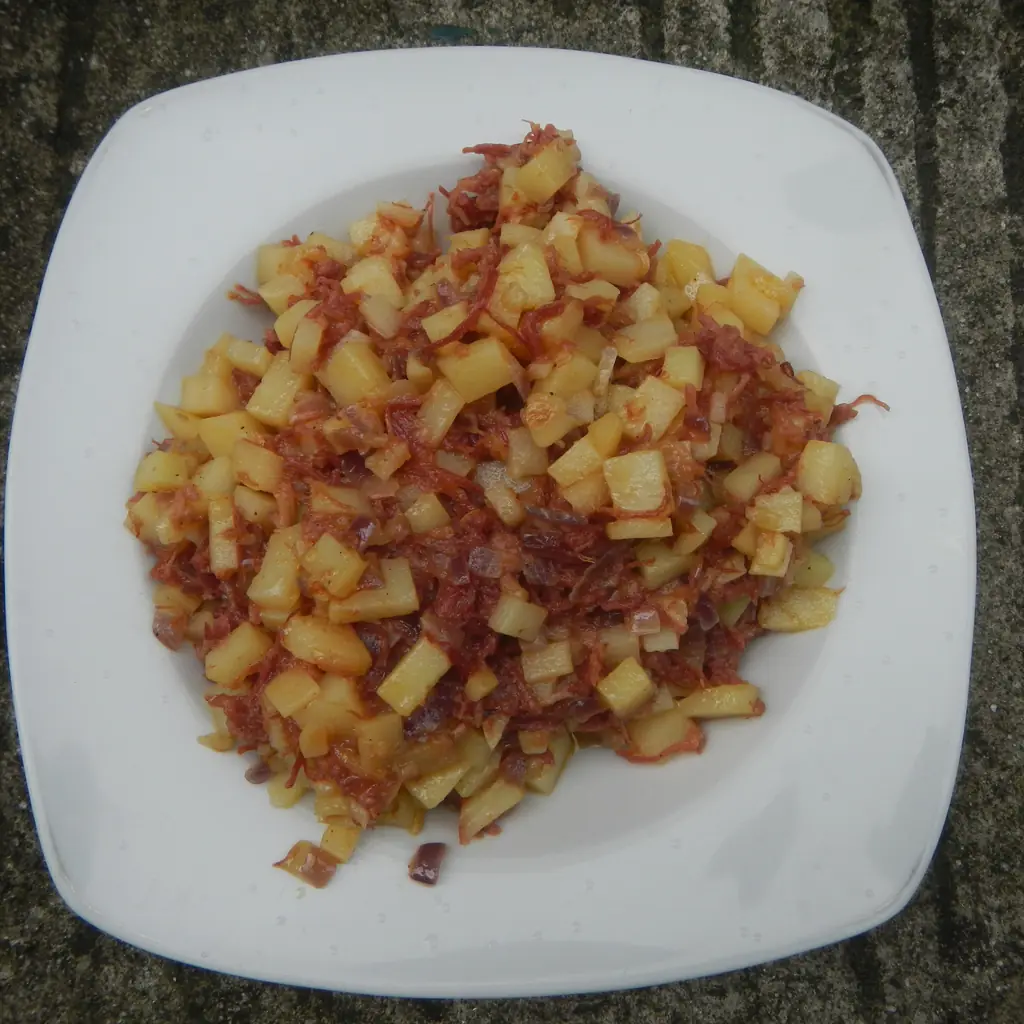 A plate of corned beef and potato hash.