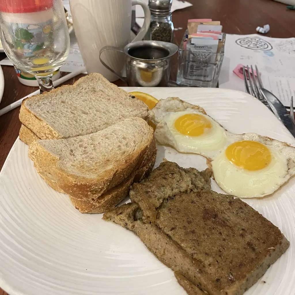 Fried scrapple with eggs and toast.